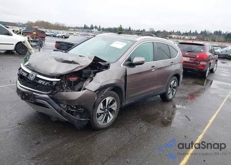 2016 Honda Cr-V Touring z USA, uszkodzony, nr VIN 5J6RM4H91GL024719